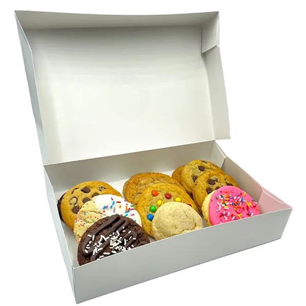 Dozen assorted cookies in a white bakery box, including chocolate chip, frosted, birthday cake, and M&M varieties.