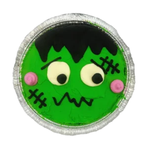 Frankenstein cookie cake decorated with green and black buttercream in a spooky Frankenstein face, 7-in.ch deep dish chocolate chip cookie