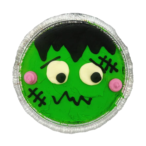 Frankenstein cookie cake decorated with green and black buttercream in a spooky Frankenstein face, 7-in.ch deep dish chocolate chip cookie