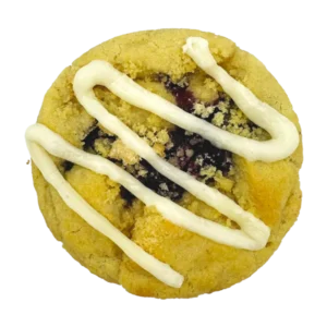 Cookie dough full of homemade pie crust is filled with blueberry pie filling, a vanilla crumble topping and a drizzle of cream cheese.
