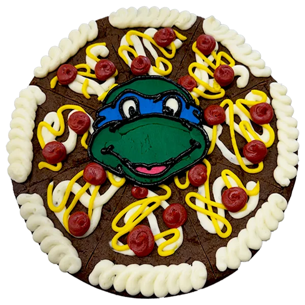 Giant chocolate, chocolate chip cookie cake decorated in a teenage mutant ninja turtle theme.