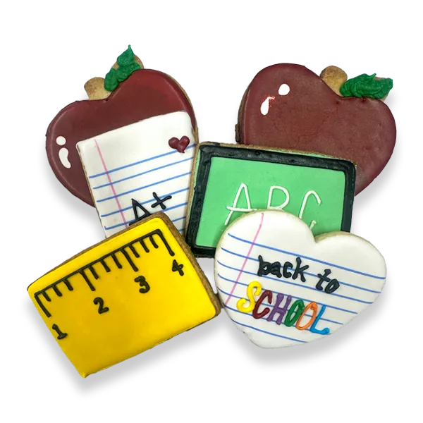 Hand-decorated Back to School sugar cookies with apples, notebooks, ruler, chalkboard, and school-themed royal icing