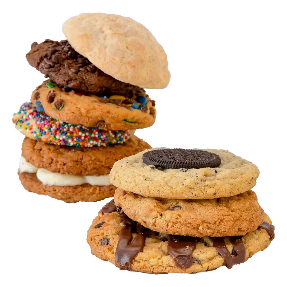 Stack of gourmet cookies in assorted flavors, including chocolate chip, sprinkle, snickerdoodle, and cookies topped with chocolate drizzle and an Oreo, showcasing The Colorado Cookie Company’s fresh-baked cookie variety.