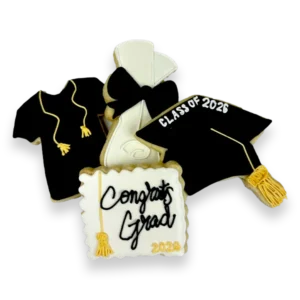 Decorated graduation sugar cookies in black, white, and gold royal icing, including a graduation cap, diploma, gown, and “Congrats Grad” plaque cookie.