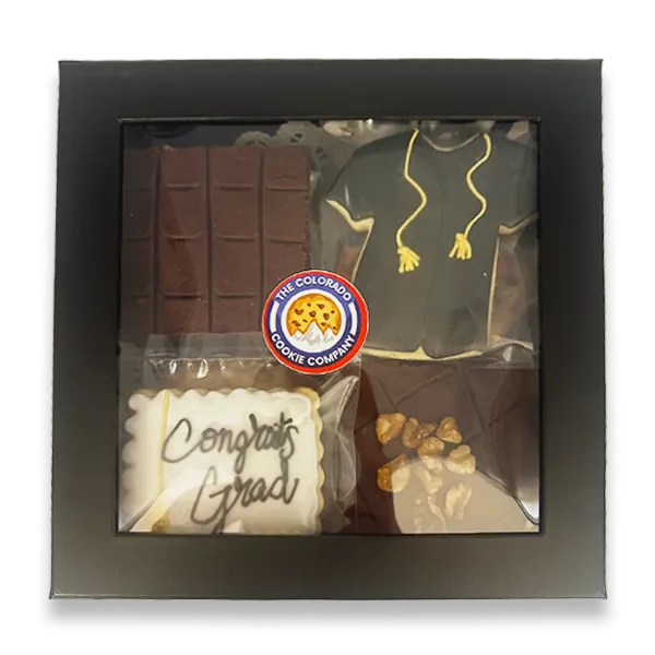Graduation Gift Box by The Colorado Cookie Company featuring a decorated graduation gown sugar cookie, Congrats Grad iced cookie, chocolate fudge brownies, and classic cookies in a black gift box