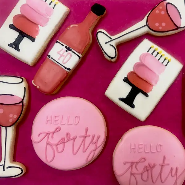 Custom decorated sugar cookies in a hello forty theme.