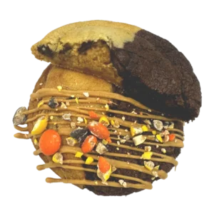 Chocolate brownie and Chocolate Chip come together after being stuffed with homemade peanut butter cookie butter, then finished off with peanut butter and Reece’s Pieces.