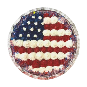 7-inch deep dish chocolate chip cookie cake, baked fresh and hand-decorated with smooth buttercream in a festive red, white, and blue flag design.